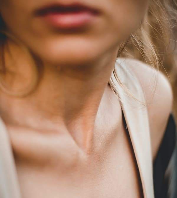 Cropped image of a woman's neck.